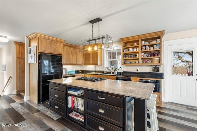 31 Gilbert Rd, Zillah, WA 98953 - kitchen with black appliances, open shelves, dark cabinetry, a kitchen island, and light stone counters