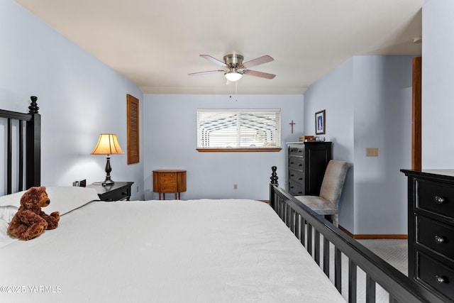 bedroom featuring a ceiling fan and baseboards