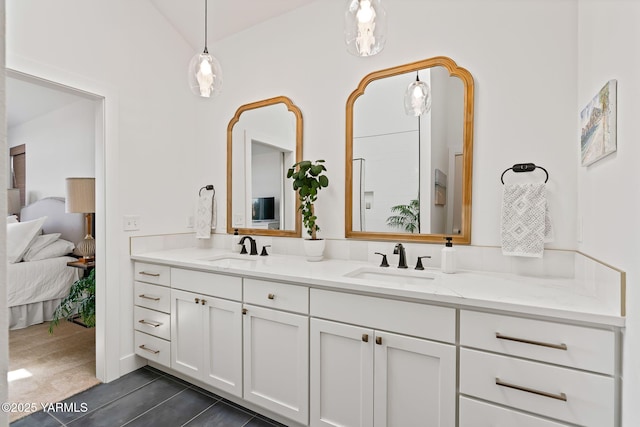4611 Hilltop Way, Yakima, WA 98908 - bathroom with double vanity, ensuite bath, tile patterned floors, and vaulted ceiling
