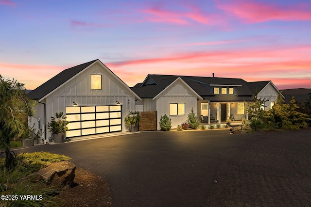 4611 Hilltop Way, Yakima, WA 98908 - modern inspired farmhouse with an attached garage, asphalt driveway, and board and batten siding