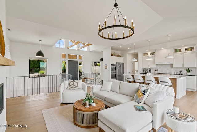 4611 Hilltop Way, Yakima, WA 98908 - living area featuring light wood-style floors, high vaulted ceiling, a chandelier, and recessed lighting