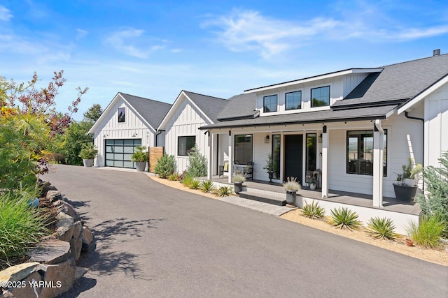 4611 Hilltop Way, Yakima, WA 98908 - modern farmhouse style home with board and batten siding, covered porch, asphalt driveway, roof with shingles, and a garage