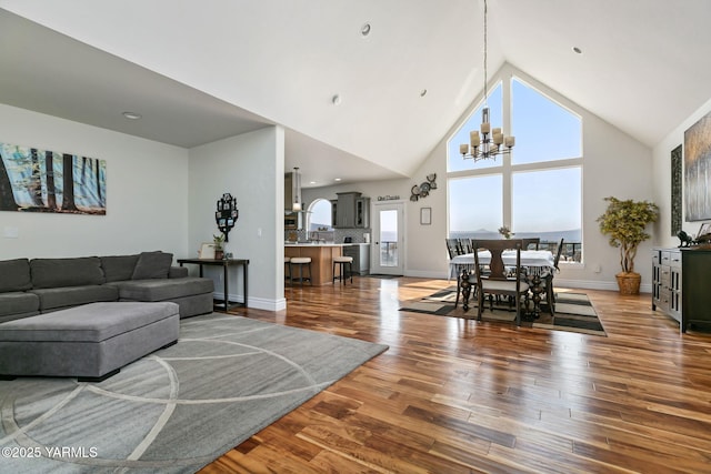 921 Tibbling Rd, Selah, WA 98942 - living room featuring a chandelier, high vaulted ceiling, and wood finished floors