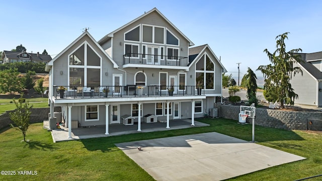921 Tibbling Rd, Selah, WA 98942 - back of house with a balcony, a lawn, and a patio