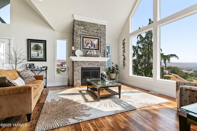 921 Tibbling Rd, Selah, WA 98942 - living area featuring a fireplace, high vaulted ceiling, and wood finished floors