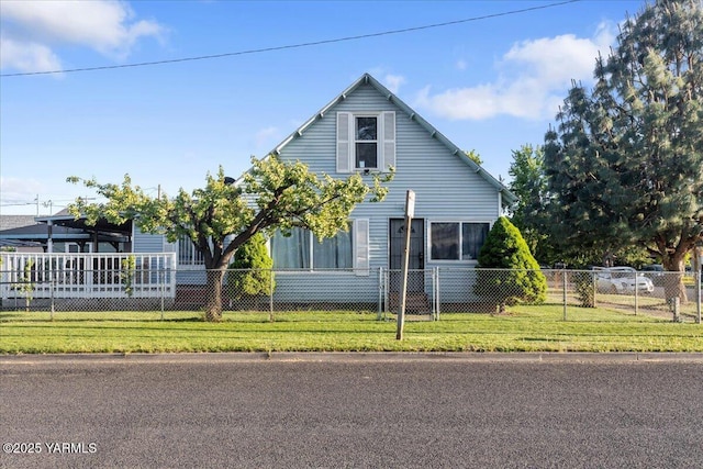 view of home's exterior with a lawn and a fenced front yard