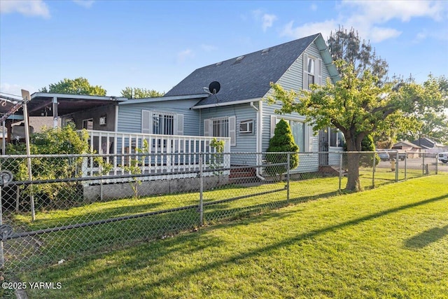 back of house featuring a yard, a shingled roof, fence private yard, and a wooden deck