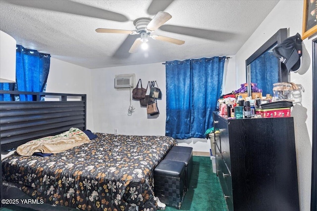 carpeted bedroom featuring a ceiling fan, a textured ceiling, and a wall mounted air conditioner