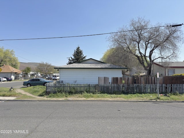 view of home's exterior featuring fence private yard