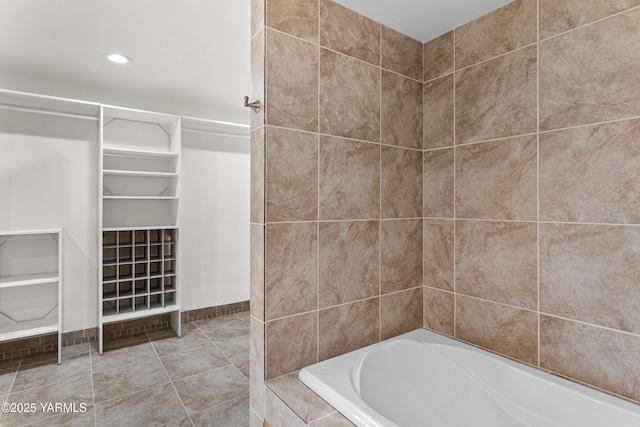 5252 US Highway 12, Yakima, WA 98908 - bathroom with tiled bath, a walk in closet, and recessed lighting