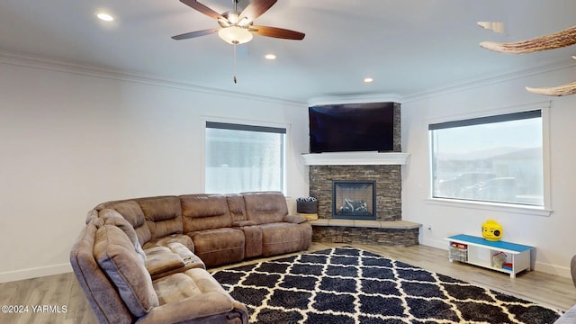 living room with plenty of natural light and ornamental molding