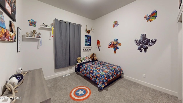 bedroom featuring light colored carpet, visible vents, and baseboards