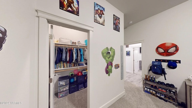 corridor featuring carpet floors and baseboards