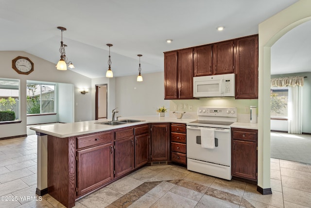 5304 Maui Pl, Yakima, WA 98908 - kitchen with white appliances, a peninsula, light countertops, lofted ceiling, and recessed lighting