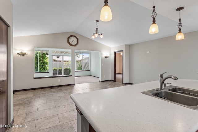 5304 Maui Pl, Yakima, WA 98908 - kitchen with lofted ceiling, hanging light fixtures, light countertops, and a chandelier