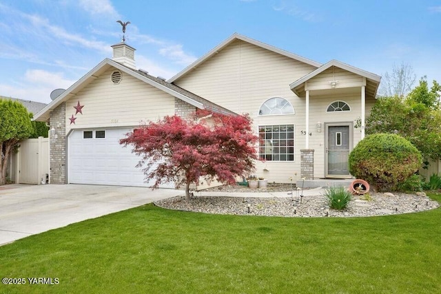5304 Maui Pl, Yakima, WA 98908 - view of front of home with an attached garage, driveway, a front yard, and a chimney