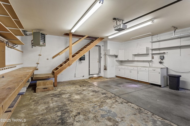 5304 Maui Pl, Yakima, WA 98908 - garage featuring a heating unit, a workshop area, and a garage door opener