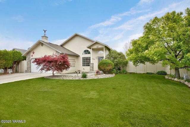 5304 Maui Pl, Yakima, WA 98908 - view of front of house with concrete driveway, a garage, and a chimney