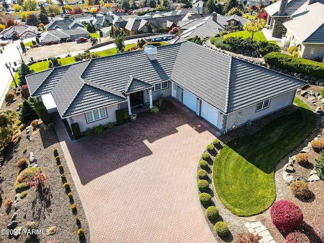 birds eye view of property with a residential view