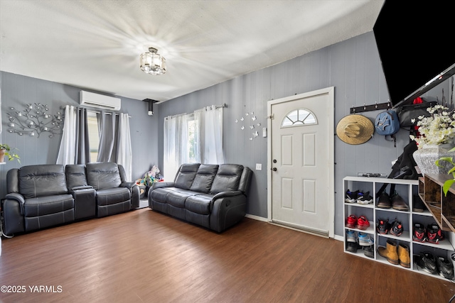 708 S 8th St, Yakima, WA 98901 - living room featuring a wall mounted air conditioner and wood finished floors