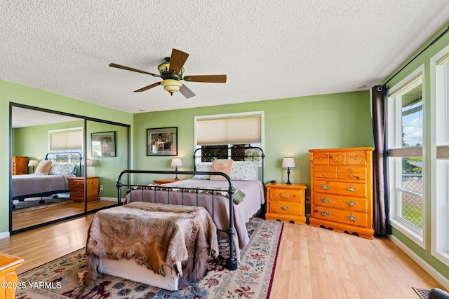 1312 Dazet Rd, Yakima, WA 98908 - bedroom with wood finished floors, a textured ceiling, and ceiling fan