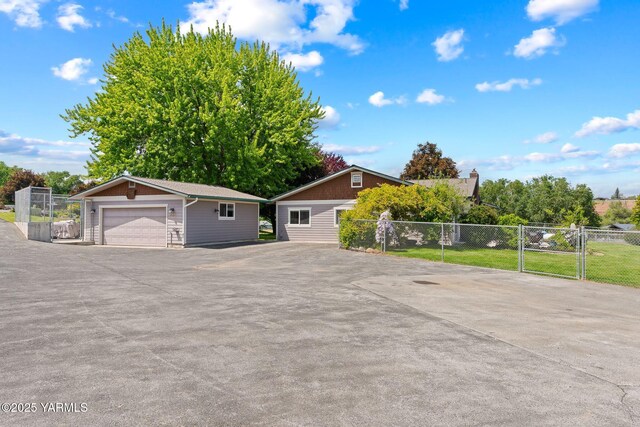 1312 Dazet Rd, Yakima, WA 98908 - view of front facade with a garage and an outdoor structure