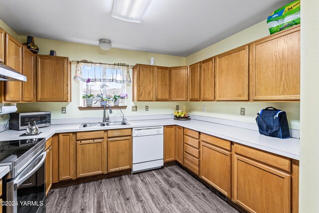 2705 Garrett St, Yakima, WA 98902 - kitchen with light countertops, white dishwasher, a sink, and stainless steel range with electric cooktop