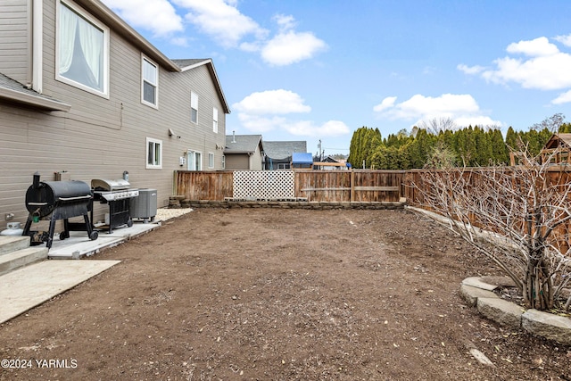2705 Garrett St, Yakima, WA 98902 - view of yard featuring a fenced backyard, a patio, and central AC