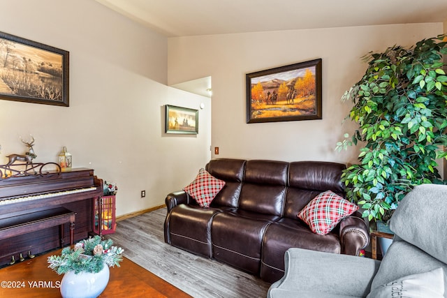 2705 Garrett St, Yakima, WA 98902 - living area featuring vaulted ceiling, baseboards, and wood finished floors