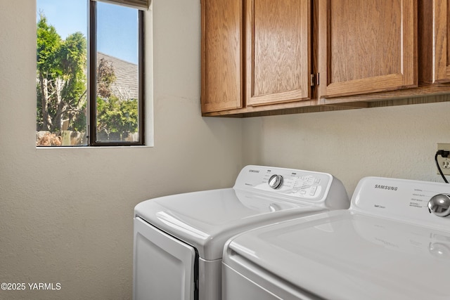 5502 Bristol Way, Yakima, WA 98908 - clothes washing area featuring washer and dryer, a textured wall, and cabinet space