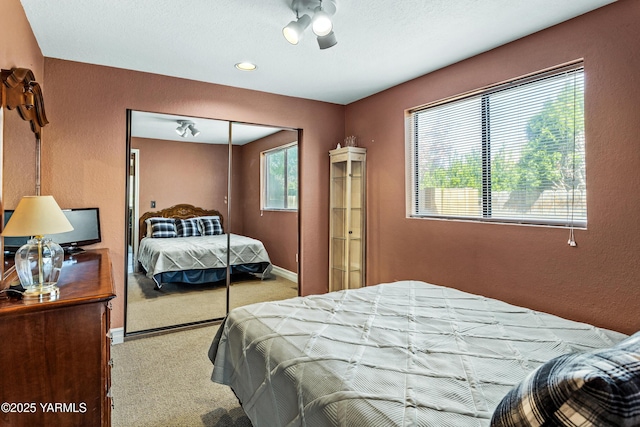 5502 Bristol Way, Yakima, WA 98908 - carpeted bedroom featuring baseboards, multiple windows, a ceiling fan, and a closet