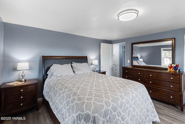 bedroom with wood finished floors