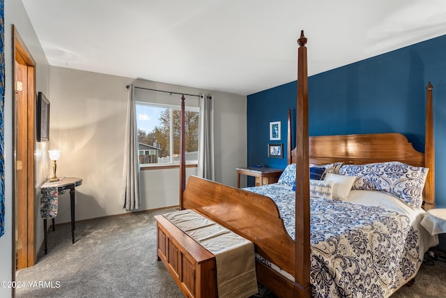 bedroom featuring dark colored carpet