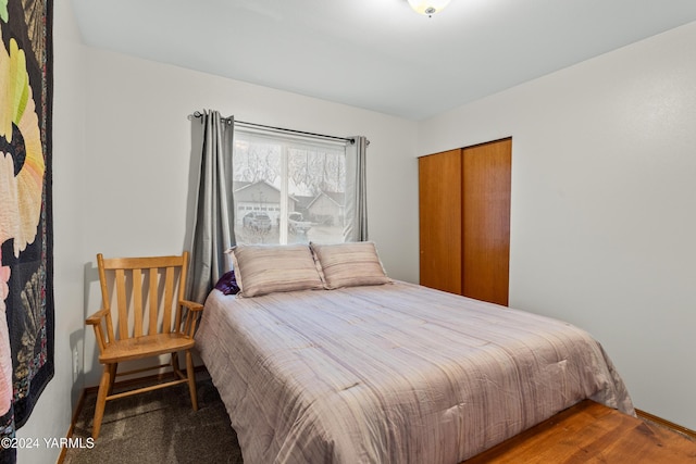 bedroom with a closet and wood finished floors