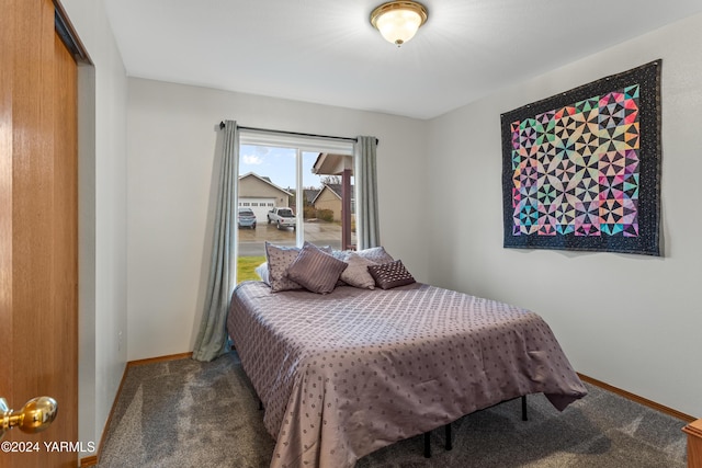 bedroom with carpet floors and baseboards