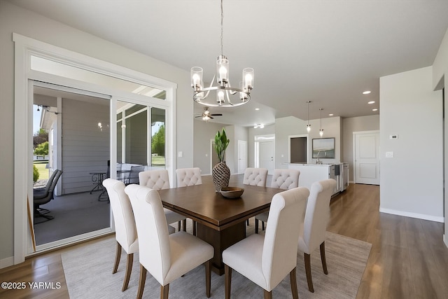 172004 NW Dogwood Rd, Prosser, WA 99350 - dining room featuring a chandelier, wood finished floors, plenty of natural light, baseboards, and recessed lighting
