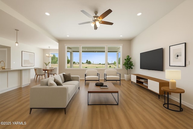 172004 NW Dogwood Rd, Prosser, WA 99350 - living area with light wood-type flooring, recessed lighting, ceiling fan, and baseboards