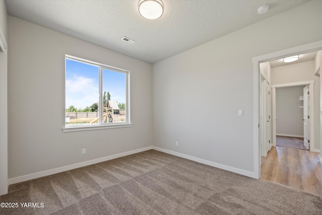 172004 NW Dogwood Rd, Prosser, WA 99350 - carpeted spare room featuring baseboards and a smoke detector