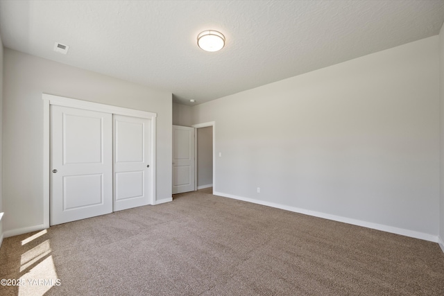 172004 NW Dogwood Rd, Prosser, WA 99350 - unfurnished bedroom featuring carpet flooring, a closet, and baseboards