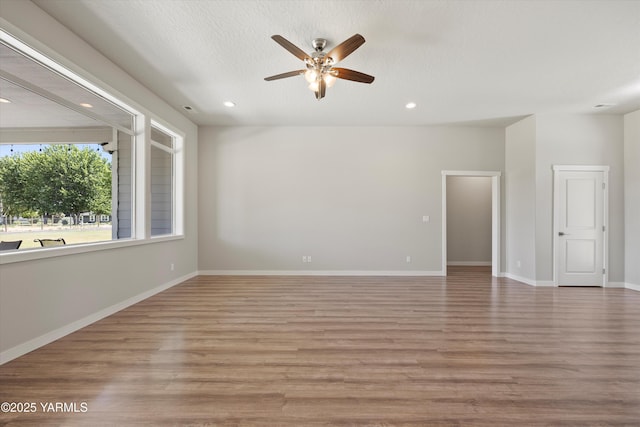 172004 NW Dogwood Rd, Prosser, WA 99350 - unfurnished room featuring ceiling fan, recessed lighting, wood finished floors, and baseboards