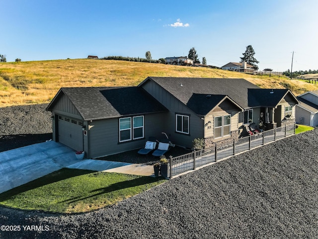 310 S 12th St, Selah, WA 98942 - ranch-style house featuring board and batten siding, driveway, a shingled roof, and a garage