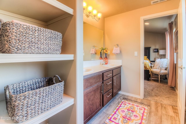 310 S 12th St, Selah, WA 98942 - ensuite bathroom featuring wood finished floors and double vanity