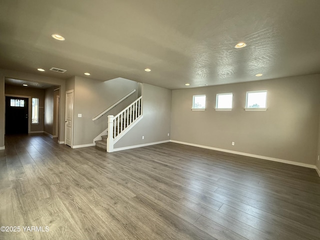 2400 S 63rd Ave, Yakima, WA 98903 - unfurnished living room featuring recessed lighting, baseboards, and stairway