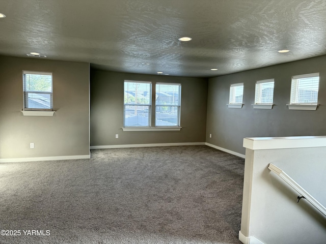 2400 S 63rd Ave, Yakima, WA 98903 - empty room featuring baseboards, a healthy amount of sunlight, and carpet