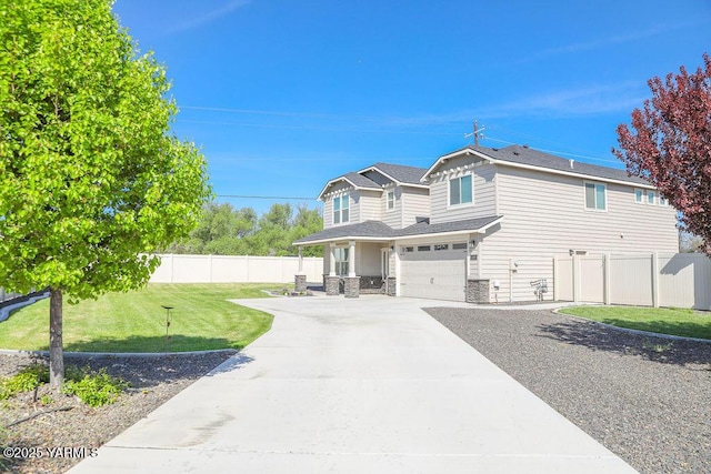 2400 S 63rd Ave, Yakima, WA 98903 - view of front of home with concrete driveway, fence, a front yard, and a garage