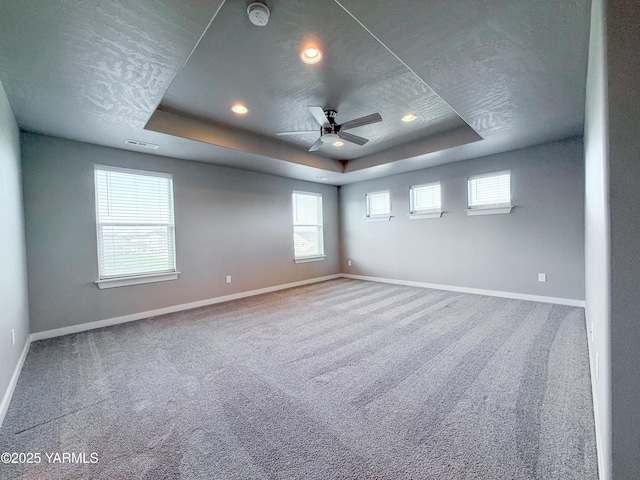 2400 S 63rd Ave, Yakima, WA 98903 - carpeted spare room featuring baseboards, visible vents, and a raised ceiling