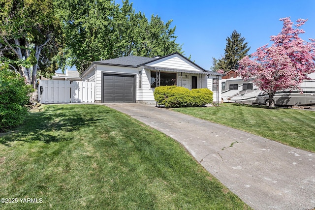 308 N 31st Ave, Yakima, WA 98902 - ranch-style house with fence, driveway, a front yard, and a garage