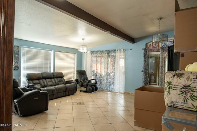 living area featuring light tile patterned flooring and beam ceiling