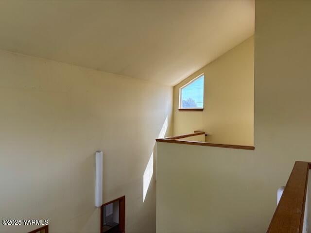 staircase featuring lofted ceiling