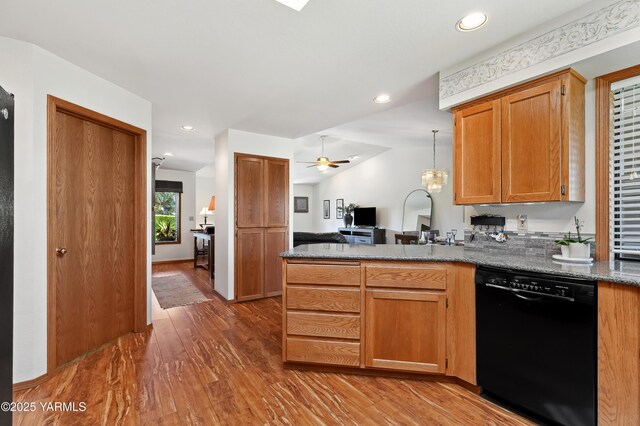101 N 48th Ave Unit 31A, Yakima, WA 98908 - kitchen with black dishwasher, wood finished floors, a peninsula, open floor plan, and recessed lighting
